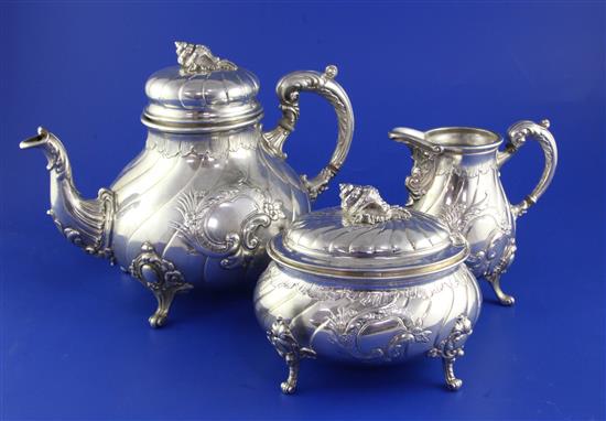 A late 19th century German 800 standard matched silver three piece tea set, gross 49 oz.